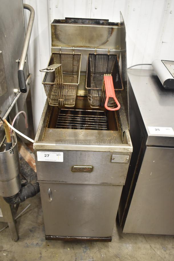 Pitco Frialator commercial deep fat fryer with two metal fry baskets on casters. Shows signs of use. Model tag visible.