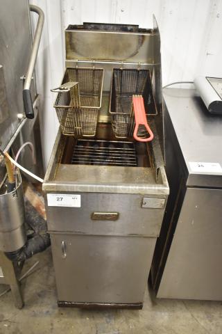 Pitco Frialator commercial deep fat fryer with two metal fry baskets on casters. Shows signs of use. Model tag visible.