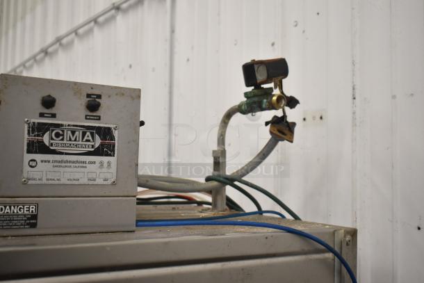 CMA EAH-2 commercial dishwasher, straight pass-through design, 120V, 1 phase. Visible wear, clear front control panel.