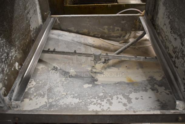 CMA EAH-2 Commercial Dishwasher interior, showing straight pass-through design, visible wear, for 120 Volts, 1 Phase.