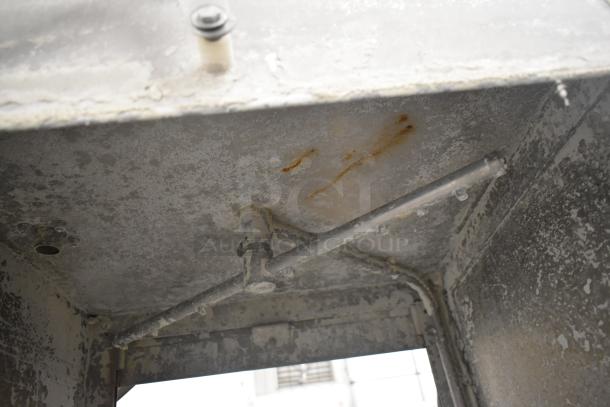 CMA EAH-2 commercial dishwasher, straight pass-through, visible interior wear, operates on 120 volts, 1 phase.