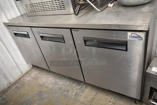 Yukon YUC-72F commercial 3-door undercounter freezer, stainless steel, on casters. 115 volts, 1 phase. Visible logo label.