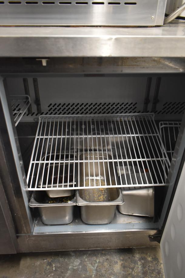 Yukon YUC-72F commercial 3-door undercounter freezer, visible wire racks, on casters. 115 Volts, 1 Phase, stainless steel.