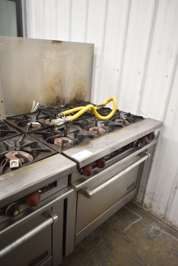 Therma-tek TMD36-6-1N commercial 6 burner gas range with oven, visible wear, yellow gas hose, and backsplash.