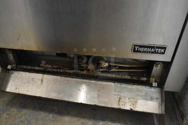 Therma-tek TMD36-6-1N commercial natural gas range with 6 burners, oven, and back splash. Visible wear and grease marks.