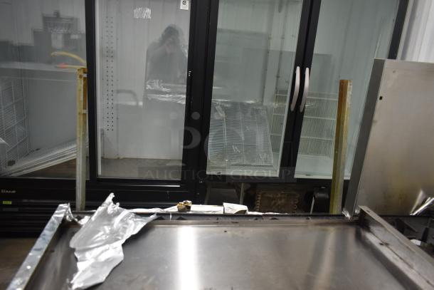 Therma-tek TMD36-6-1N gas range with 6 burners, oven, and backsplash. Commercial-grade. Stainless steel. Moderate wear.