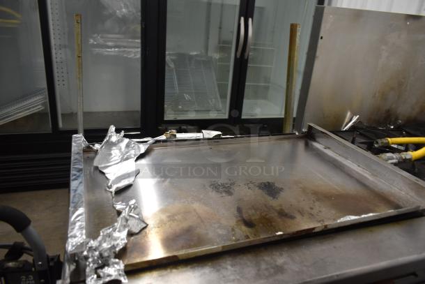 Therma-tek TMD36-6-1N 6 burner range, natural gas, with oven and backsplash; shows signs of use, foil remnants present.