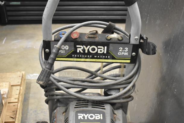 Ryobi 2.3 GPM Pressure Washer, 2300 PSI, hoses coiled, visible Ryobi branding, lightly used condition.