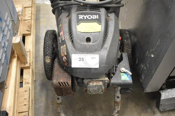 Ryobi 2.3 GPM Pressure Washer in used condition, visible rust on metal parts, labeled "35." Model features sturdy wheels.