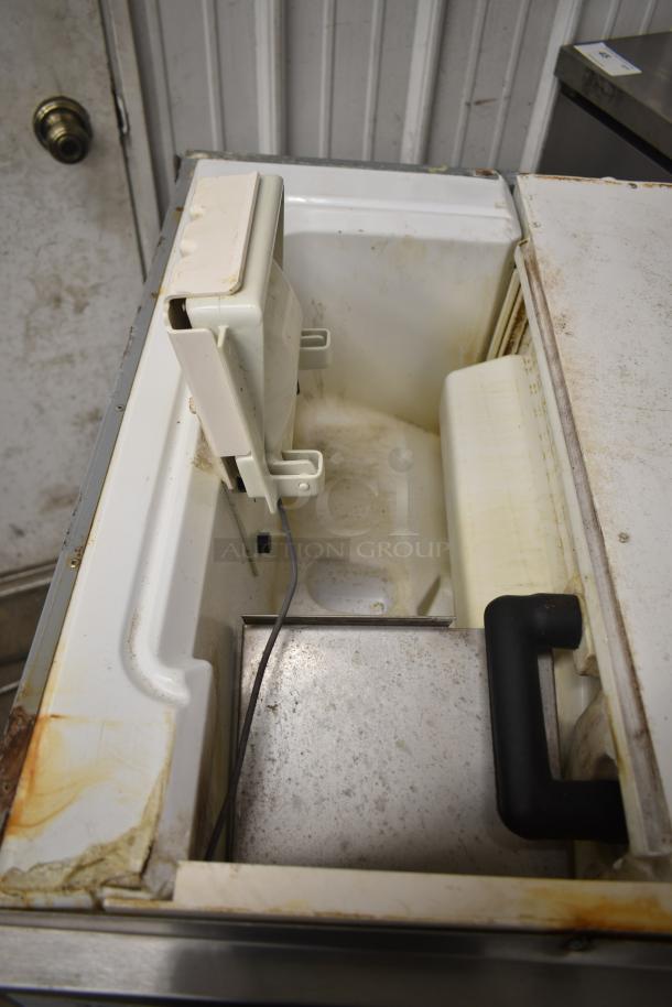 Hoshizaki KM-650MAH commercial ice machine head, visible wear, 661-lb/24-hr capacity, 208-230V, 1 Phase.