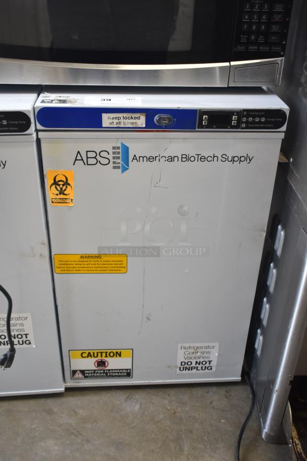ABS ABT-UCFS-0204 undercounter cooler, 2.5 cu.ft., single door, used, visible caution and biohazard labels, 115 volts, model ABT-UCFS-0204.