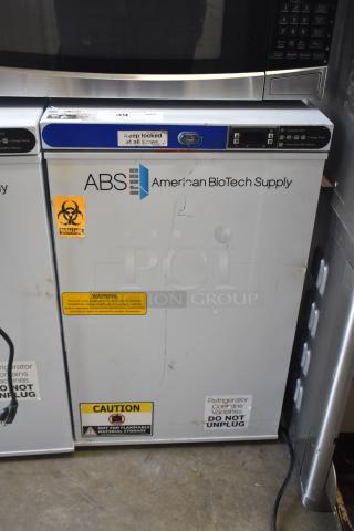 ABS ABT-UCFS-0204 undercounter cooler, 2.5 cu.ft., single door, used, visible caution and biohazard labels, 115 volts, model ABT-UCFS-0204.