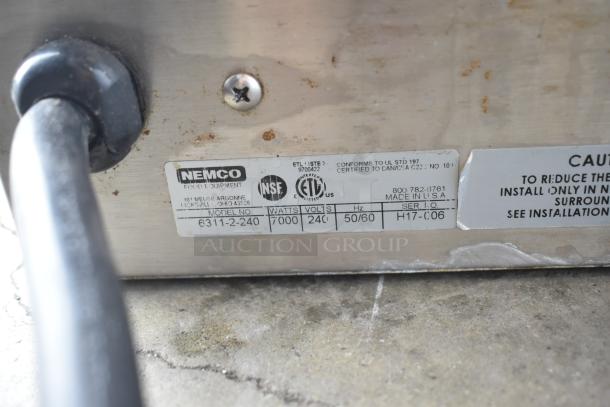 Nemco 6311-2-240 4-burner electric hot plate, 240V, 7000 watts, label indicates NSF certification, model, and serial info.