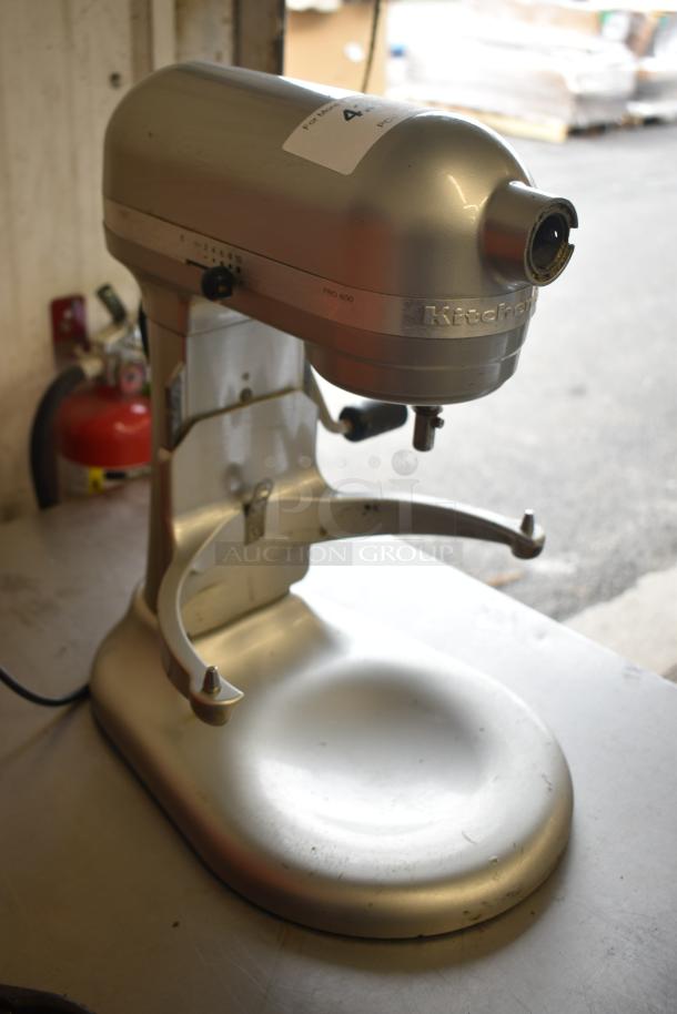 KitchenAid KF26M22SR mixer, 6-quart, planetary design, 120V, silver finish, good condition, minor surface wear.