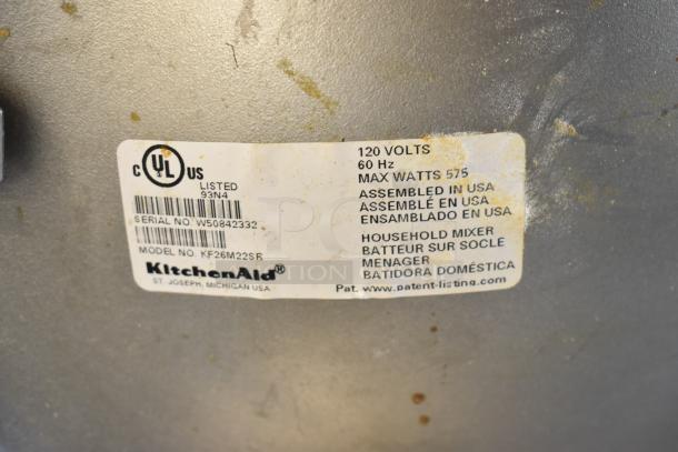 KitchenAid KF26M22SR countertop mixer label showing 120 volts, 575 watts, serial no. W50842332, assembled in USA.