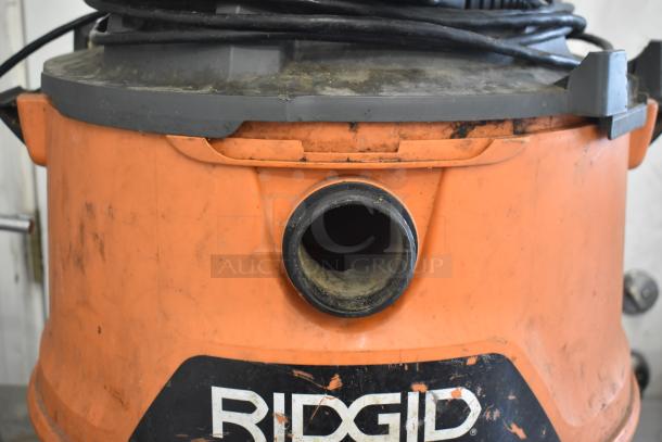 Rigid HD16000 Wet Dry Shop Vac Vacuum Cleaner, 120V, used, visible wear, model HD16000, orange body, black hose.
