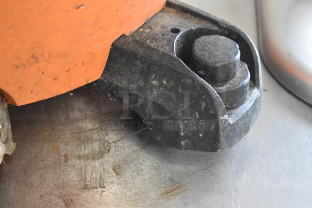 Close-up view of a Rigid HD16000 wet dry vacuum wheel, showing signs of wear and use.