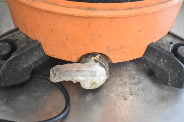 Rigid HD16000 Wet Dry Shop Vac, orange base, partially wrapped nozzle, visible signs of use. Model HD16000, 120V, 1-phase.