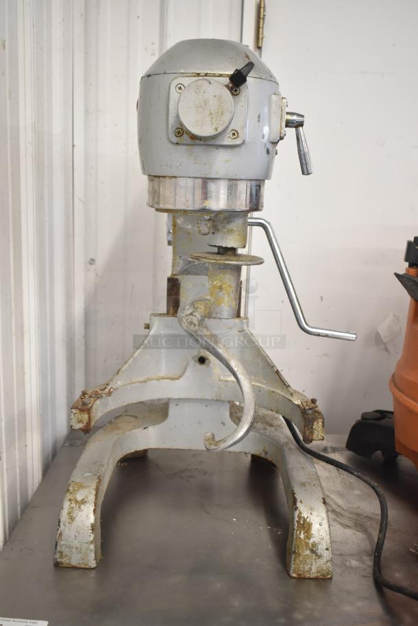 BakeMax BMPME20 20 Quart commercial dough mixer with dough hook, 110V 1-phase. Visible wear and rust, sturdy build.