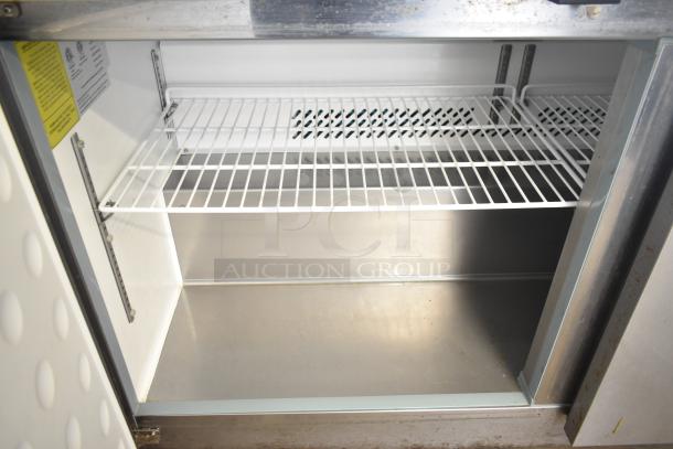 Yukon YUC-60F commercial 2-door undercounter freezer with wire shelving. 115 volts, 1 phase. Clean interior, on casters.