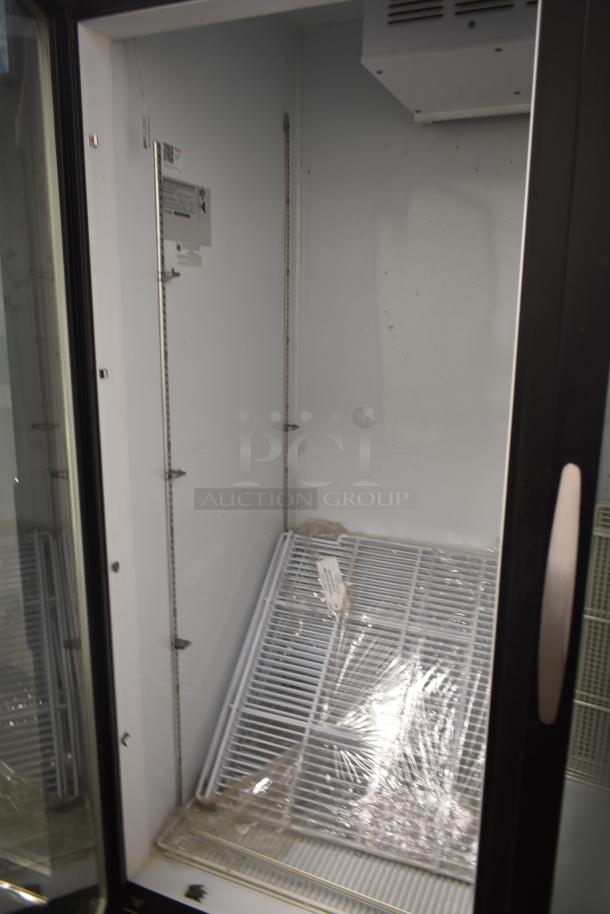 Beverage Air MMR49HC-1-B 2-door cooler, 115V, 1 Phase. Interior view with shelves, good condition, visible labels.