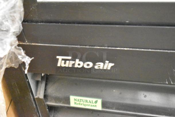 Turbo Air TGM-48RB-N cooler with "Natural Refrigerant" label, black finish, visible brand logo.