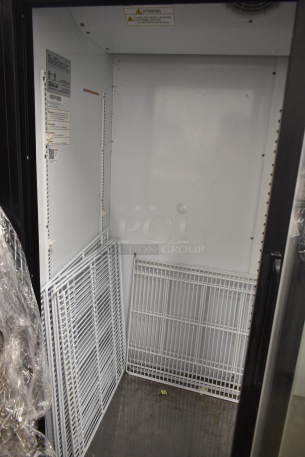 Turbo Air TGM-48RB-N commercial cooler, interior view with shelves, labels for model and safety warnings visible.