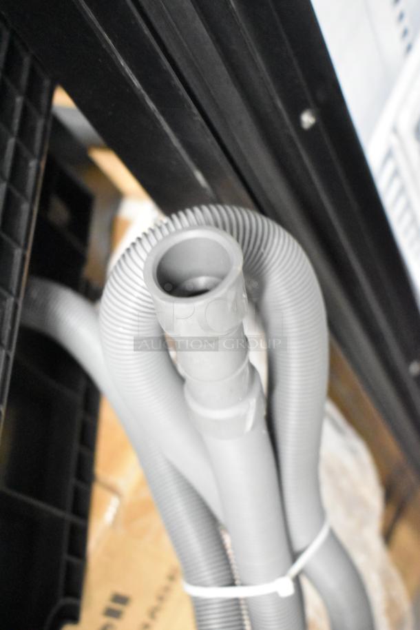 Close-up of dishwasher hose and tube components. Part of Honeywell HDS18SS dishwasher, 2025 model.