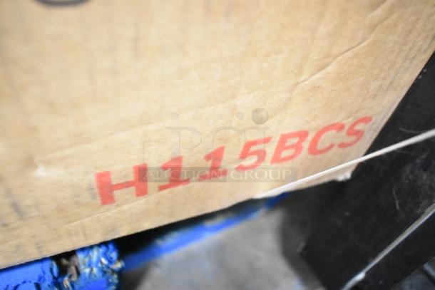 Cardboard box with "H115BCS" printed, indicating a Honeywell 115 Can Cooler Refrigerator, brand new with minor scratches.