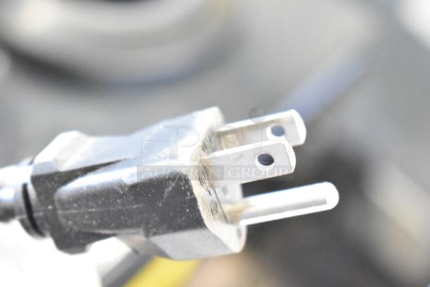 Close-up of a power plug for Avalon A10-TL Water Dispenser, 115 Volts, 1 Phase. Plug shows minor wear, indicating light use.