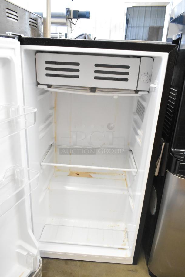 Frigidaire EFR323-6COM Mini Cooler, 115 Volts, 1 Phase. White interior, some staining visible. Two wire shelves inside.