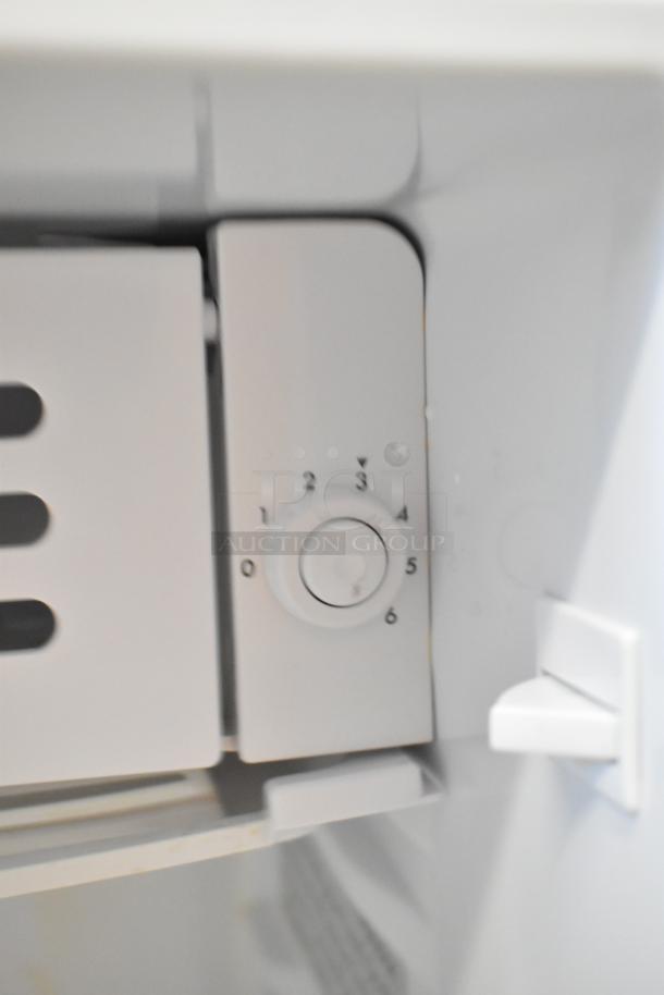 Frigidaire EFR323-6COM Mini Cooler interior control dial, 115V, 1 Phase, white finish, temperature settings visible.