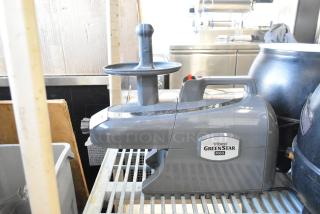 Tribest GS-P502 GreenStar Pro juicer, gray, 120 volts, 1 phase. Like new, logo visible, suitable for countertop use.
