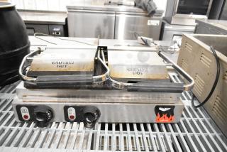 Vollrath TSI8002 40796 commercial double panini press, 220V, 1 phase, showing slight wear, "Caution Hot" labels visible.