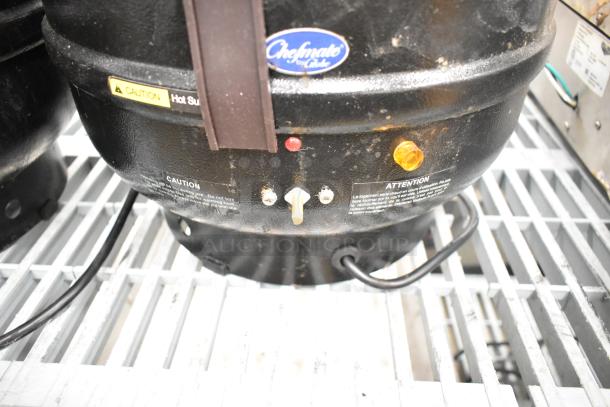 Chefmate CPSKB1 soup kettle food warmer on grill. Black, commercial use, 120 volts, caution labels visible.
