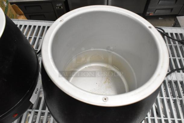 2 Glenray commercial countertop soup kettles, black and silver; minor wear; 120 volts, 1 phase visible on label.