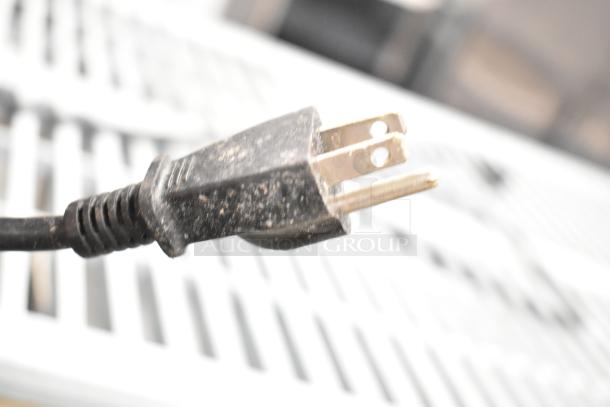 Close-up of a three-prong electrical plug for Glenray Commercial Soup Kettle, 120 volts, 1 phase.