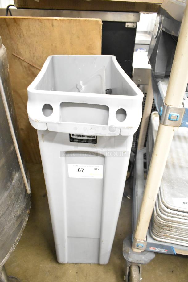 Rubbermaid Brute gray poly Slim Jim trash can with contents including tongs and serving spoons, visible label and auction tag.