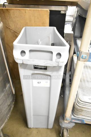 Rubbermaid Brute gray poly Slim Jim trash can with contents including tongs and serving spoons, visible label and auction tag.