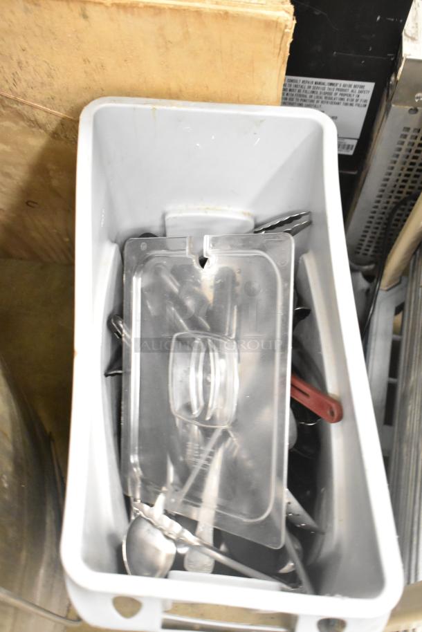 Rubbermaid Brute gray poly Slim Jim trash can with tongs and serving spoons inside, good condition.