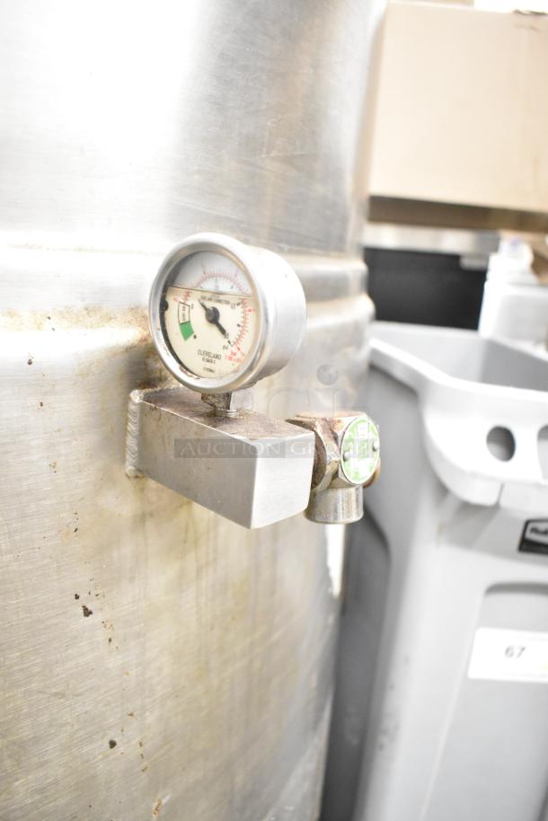Cleveland KEL-100 100-gallon steam jacketed kettle, pressure gauge visible, showing stainless steel surface and some wear.