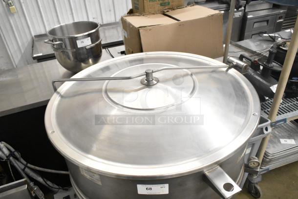 Cleveland KEL-100 commercial 100-gallon steam jacketed kettle, stainless steel, with cover, in good condition. Visible auction label.