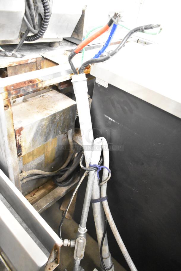 Cleveland KEL-100 100-gallon stationary steam jacketed electric kettle, showing wiring and connections; condition appears worn.