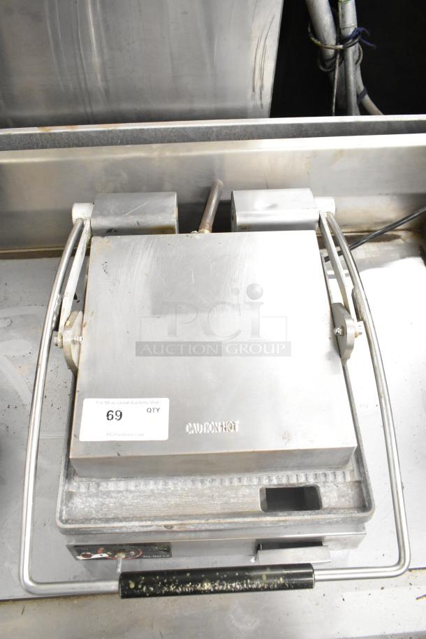 Star SGT14 Commercial Panini Press, 120V, 1 Phase. Features stainless steel body, caution marking, visible wear.