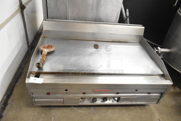 MagiKitch'n commercial countertop flat top griddle, chrome surface, used condition, visible controls, and manufacturer logo.