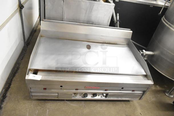 MagiKitch'n commercial countertop chrome top flat top griddle. Features dual controls, stainless steel finish, and built-in backsplash.