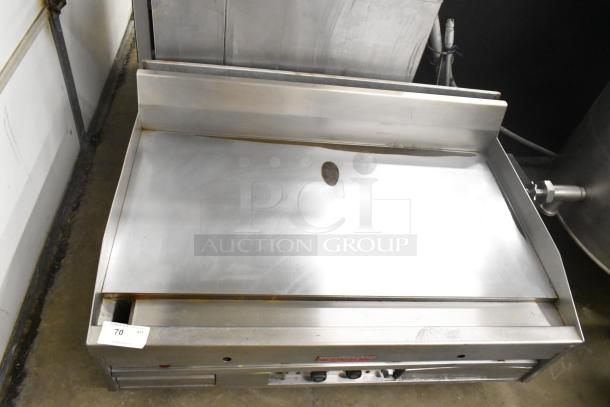 MagiKitch'n commercial countertop chrome top griddle, stainless steel, used condition, includes control knobs, flat top surface.