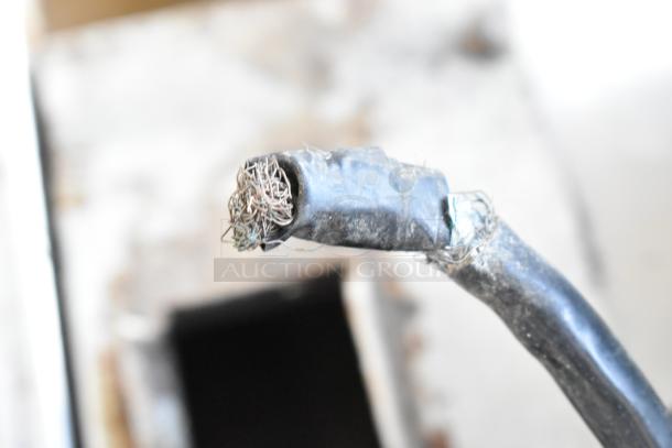 Damaged power cord of Star PGT14 Commercial Panini Press, showing frayed wires and worn insulation.