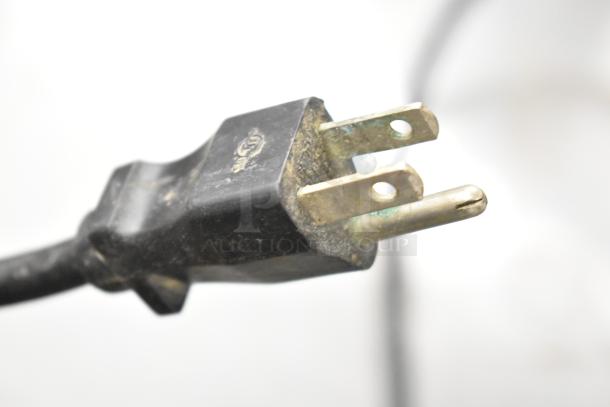 2017 Bunn VP17-2 coffee machine plug, well-used condition, 120 volts. Visible wear on prongs. Commercial use.