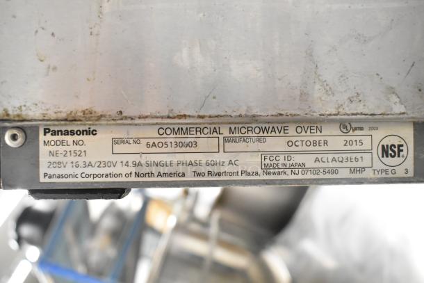 Panasonic NE-21521 commercial countertop microwave oven label showing model, serial number, voltage, and FCC ID.